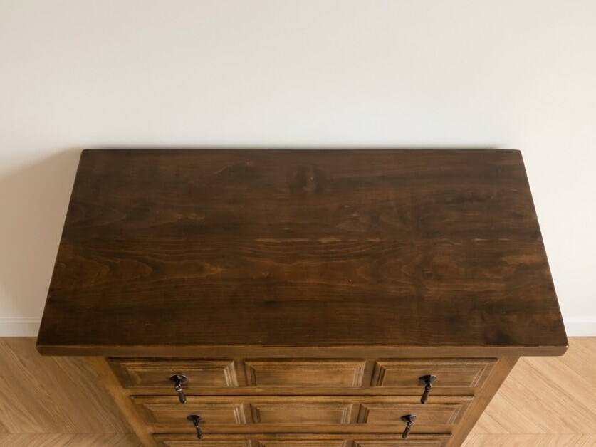 Antique solid wood chest of drawers with five drawers.