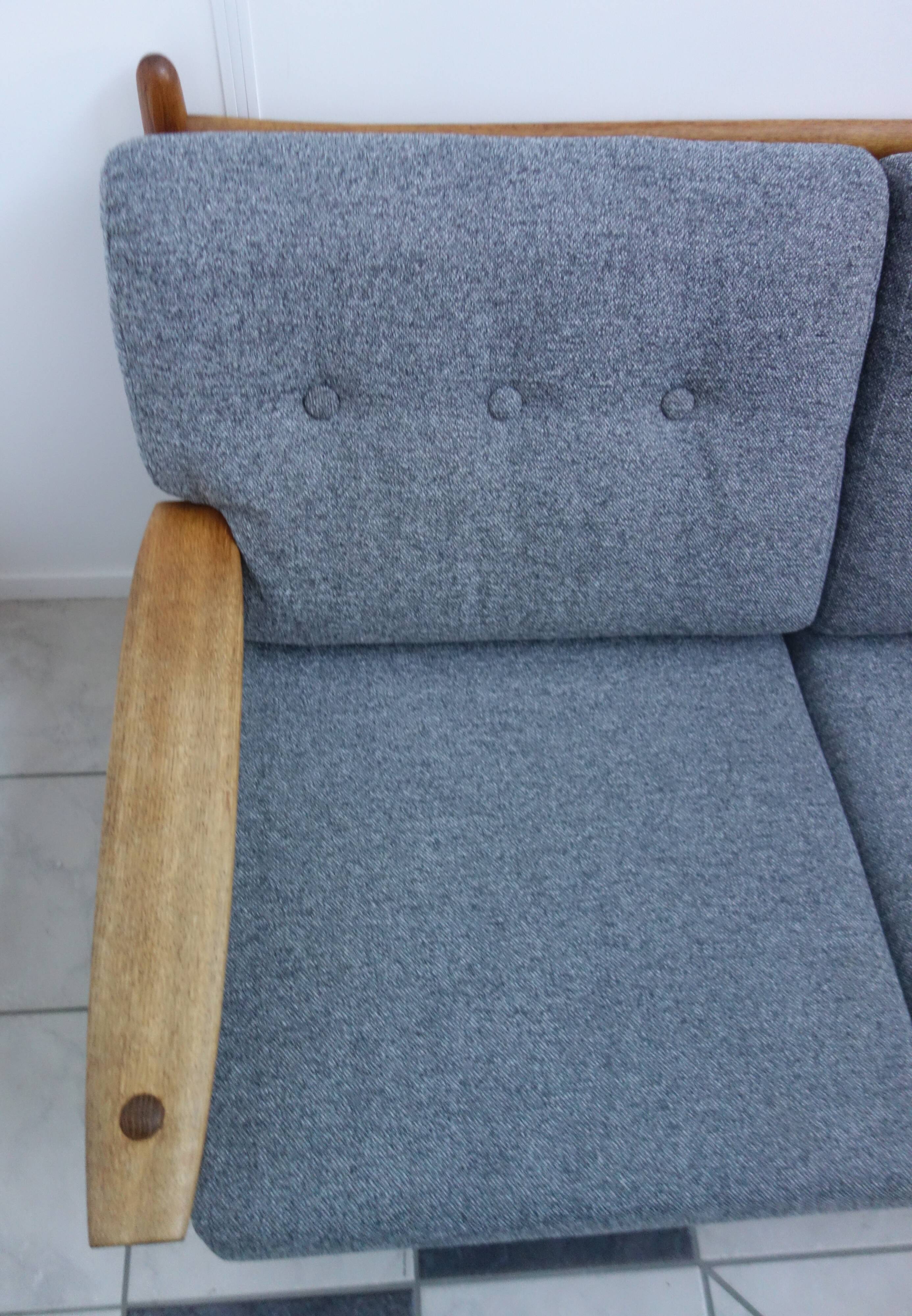 Three seater sofa in fabric and wood