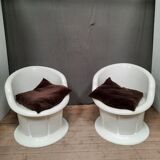 Pair of white plastic armchairs