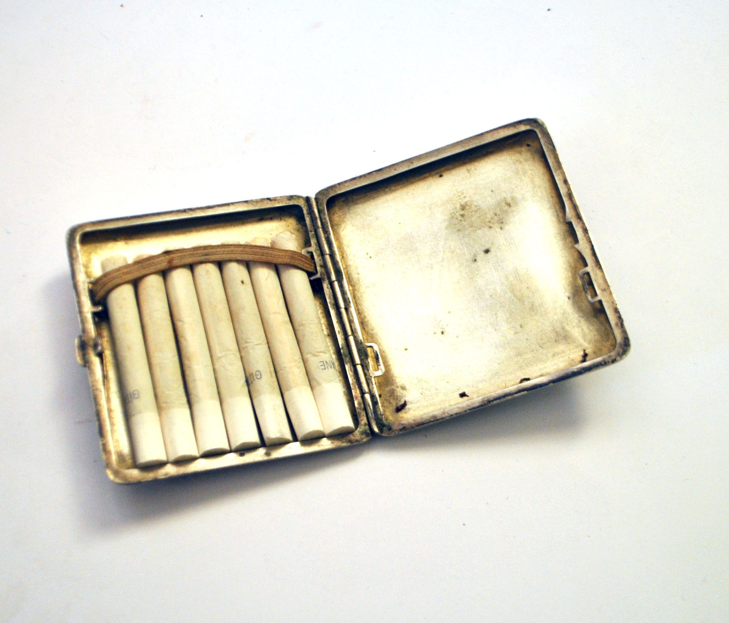 Art Deco cigarette case, alpaca cigarette holder with WS monogram.
