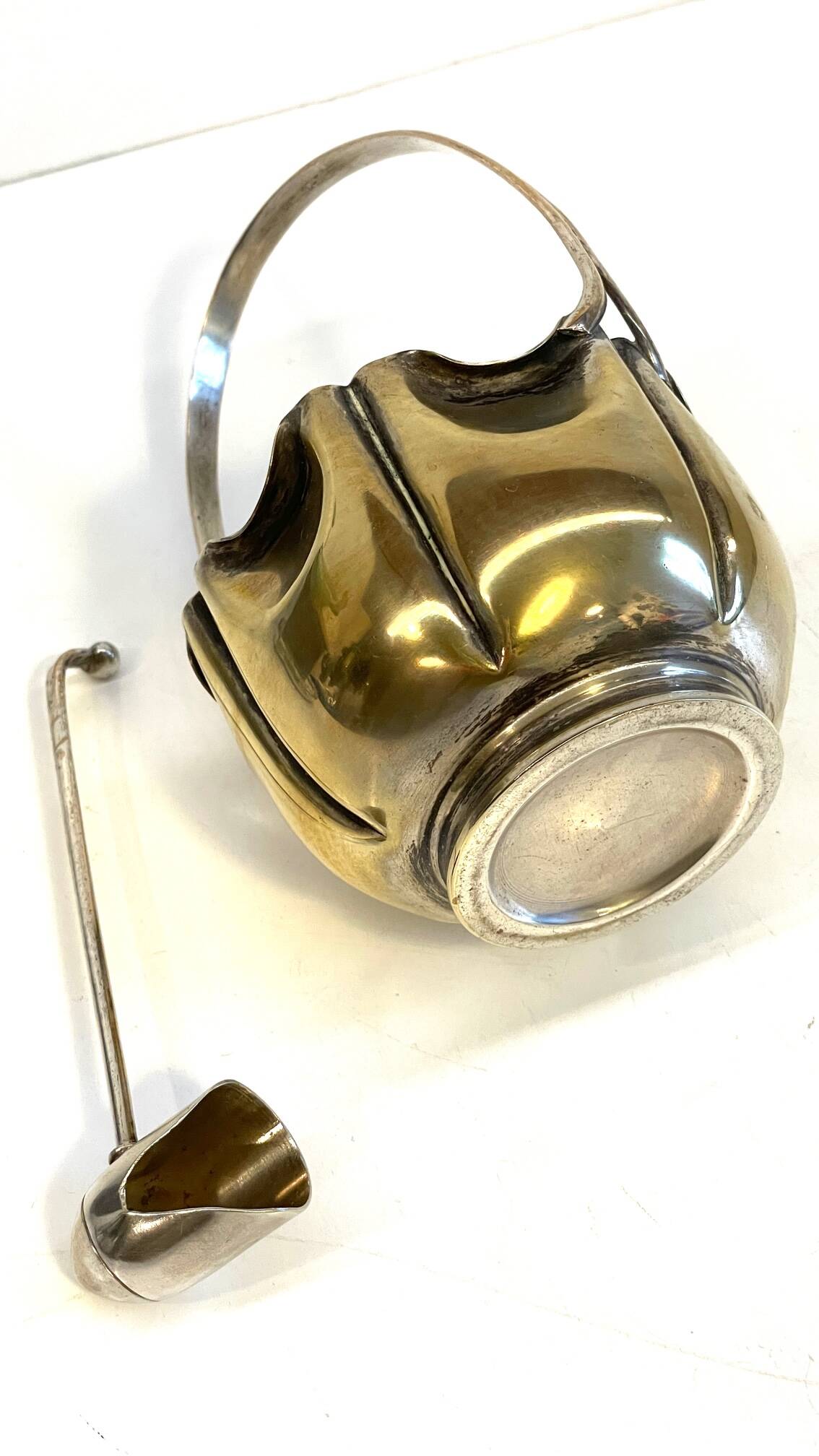 silver metal sugar bowl with gold patina