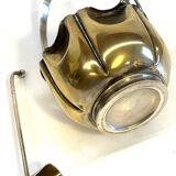 silver metal sugar bowl with gold patina