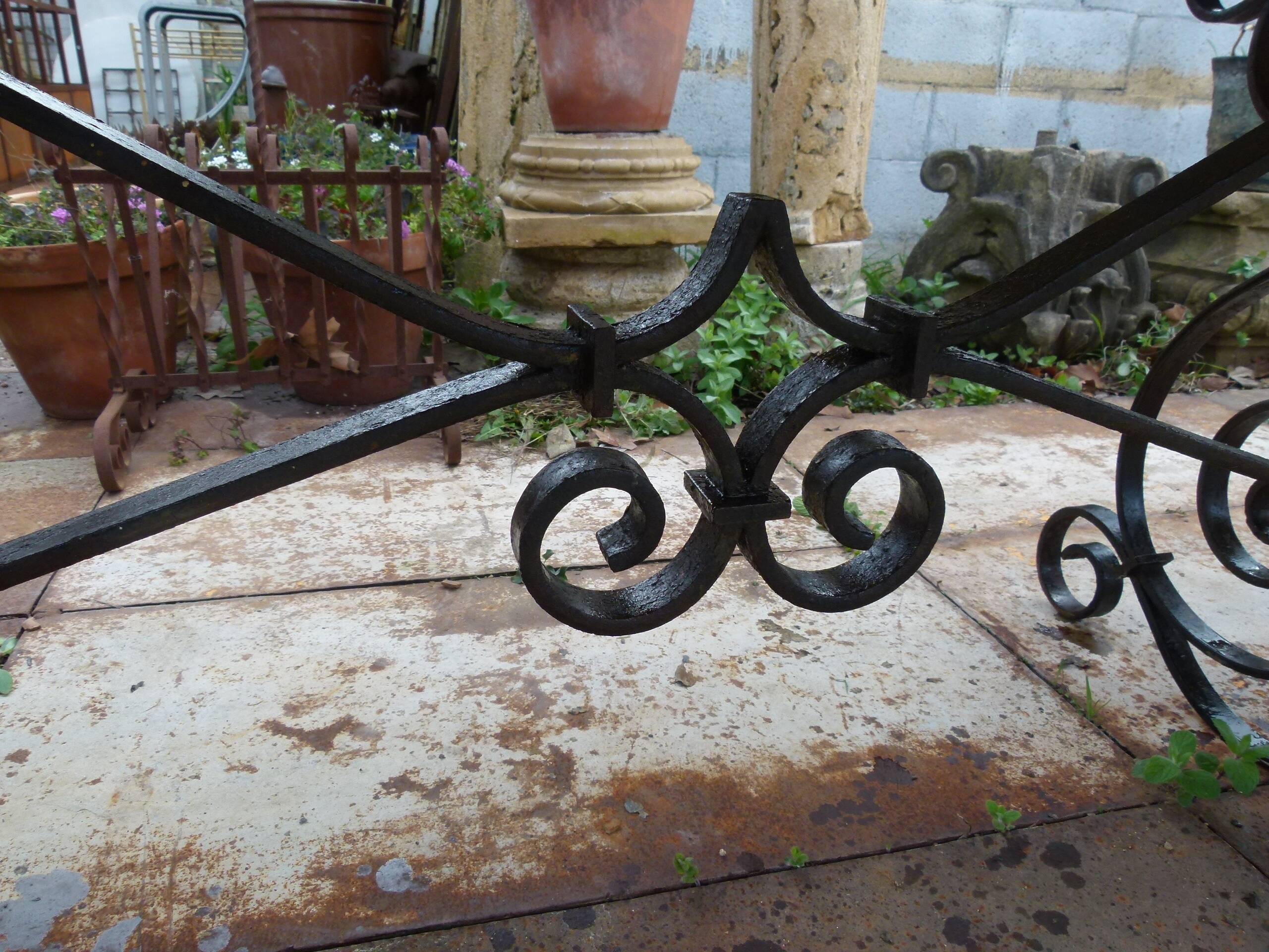 Marble table with wrought iron legs.