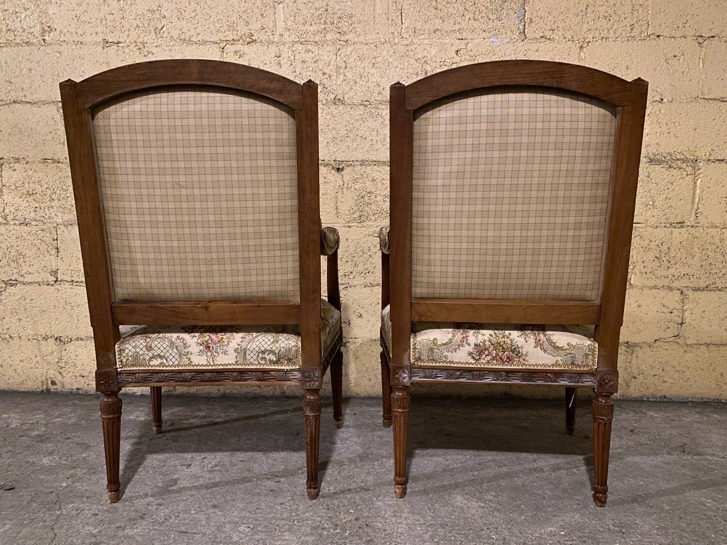 Pair of antique carved wooden armchairs