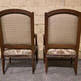Pair of antique carved wooden armchairs