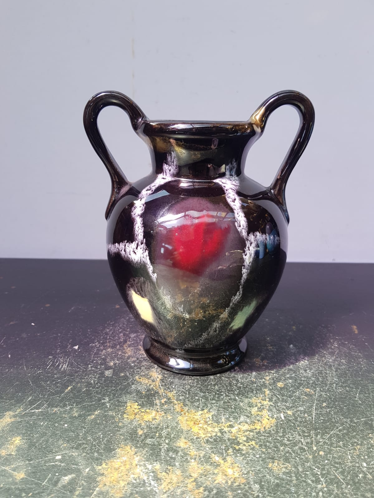 Old vase with coves ceramic black