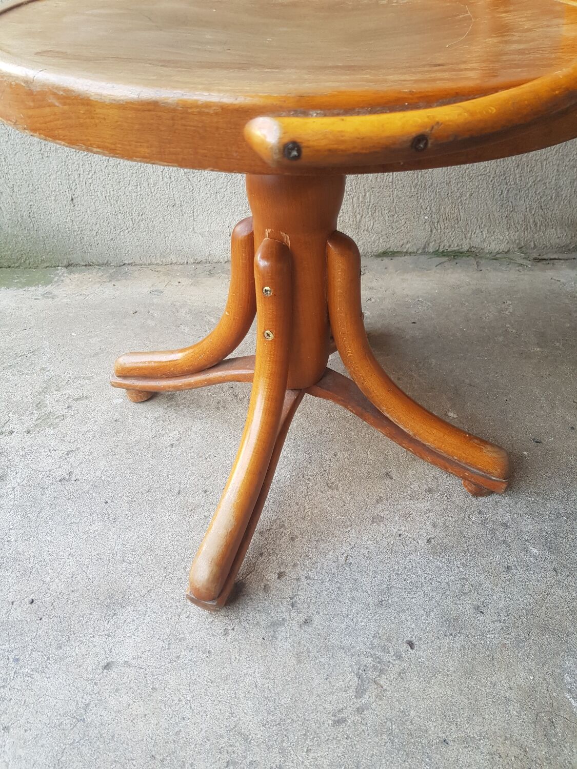 Swivel wooden armchair