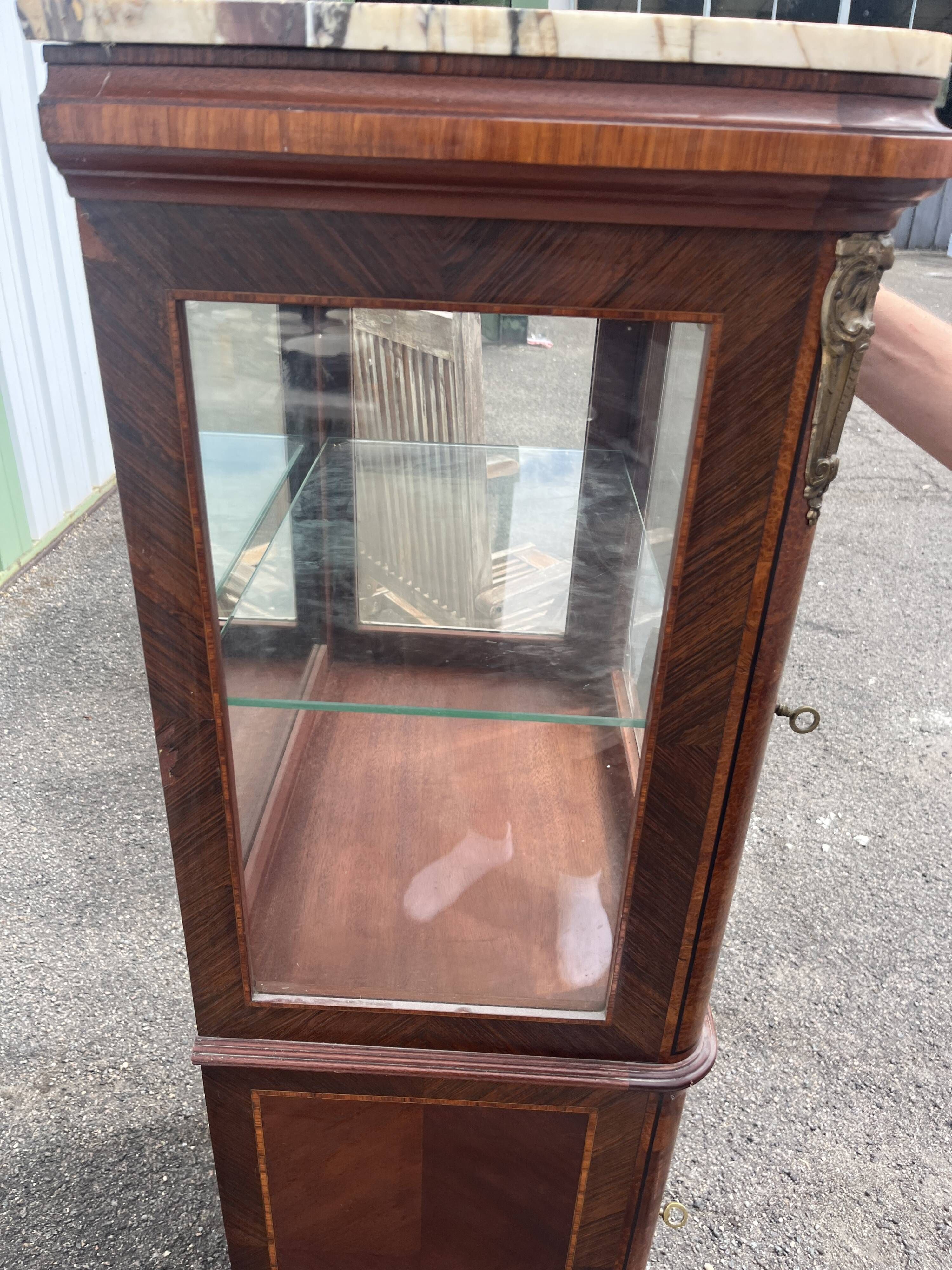 Louis XVI style display cabinet, 19th century, marble and gilded bronzes.