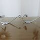 Pair of chrome metal coat hooks from the 1970s.