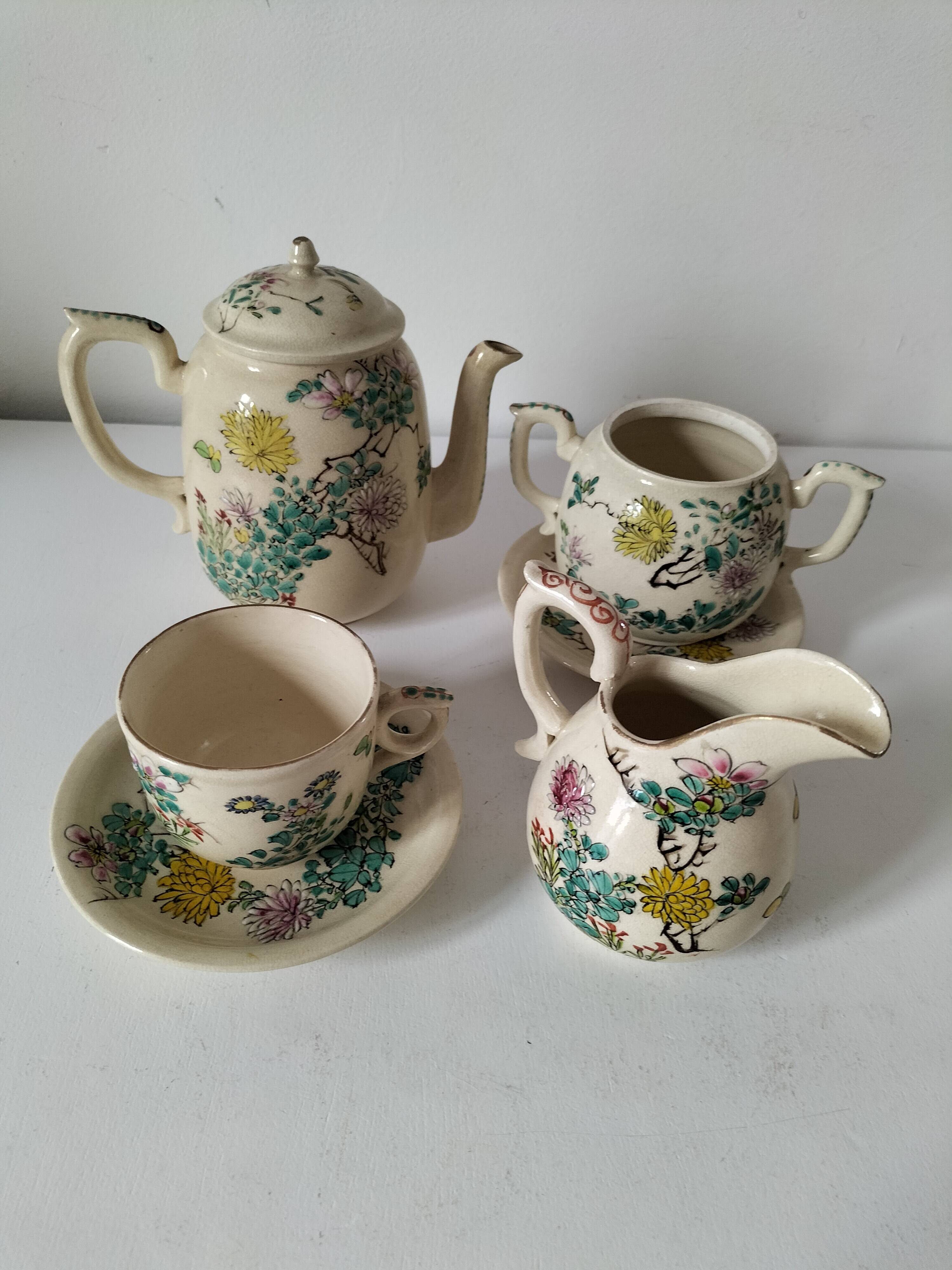 Japanese-style tea set in cracked earthenware with chrysanthemum flowers