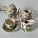 Japanese-style tea set in cracked earthenware with chrysanthemum flowers