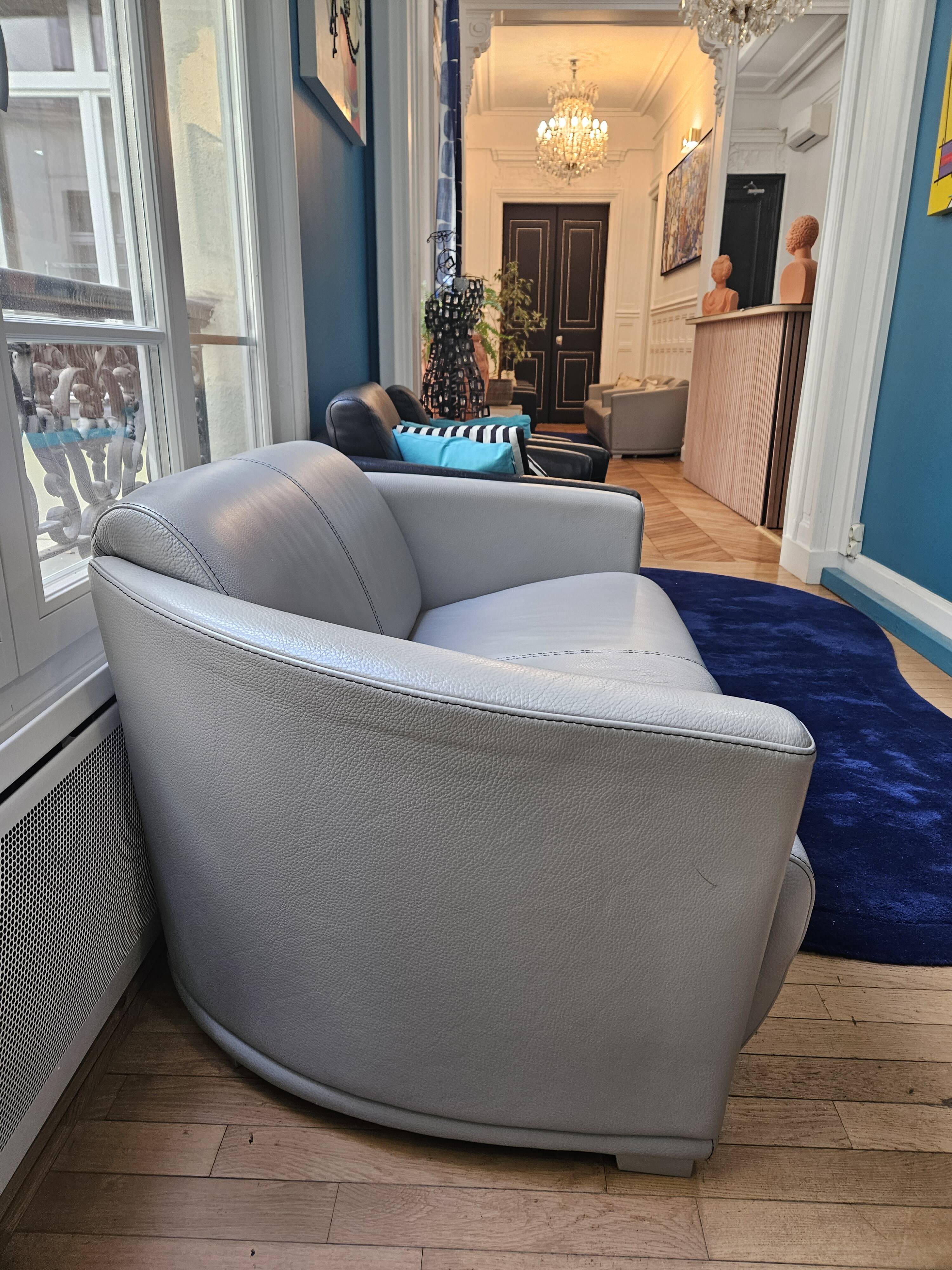 3-seater sofa, 2-seater sofa and an armchair in grey leather by Calia Italia.