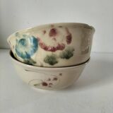 Two large vintage bowls in pastel decor on mini pedestals.