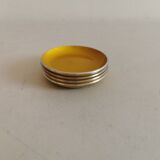 Set of four enameled coasters - ashtrays in original yellow color.
