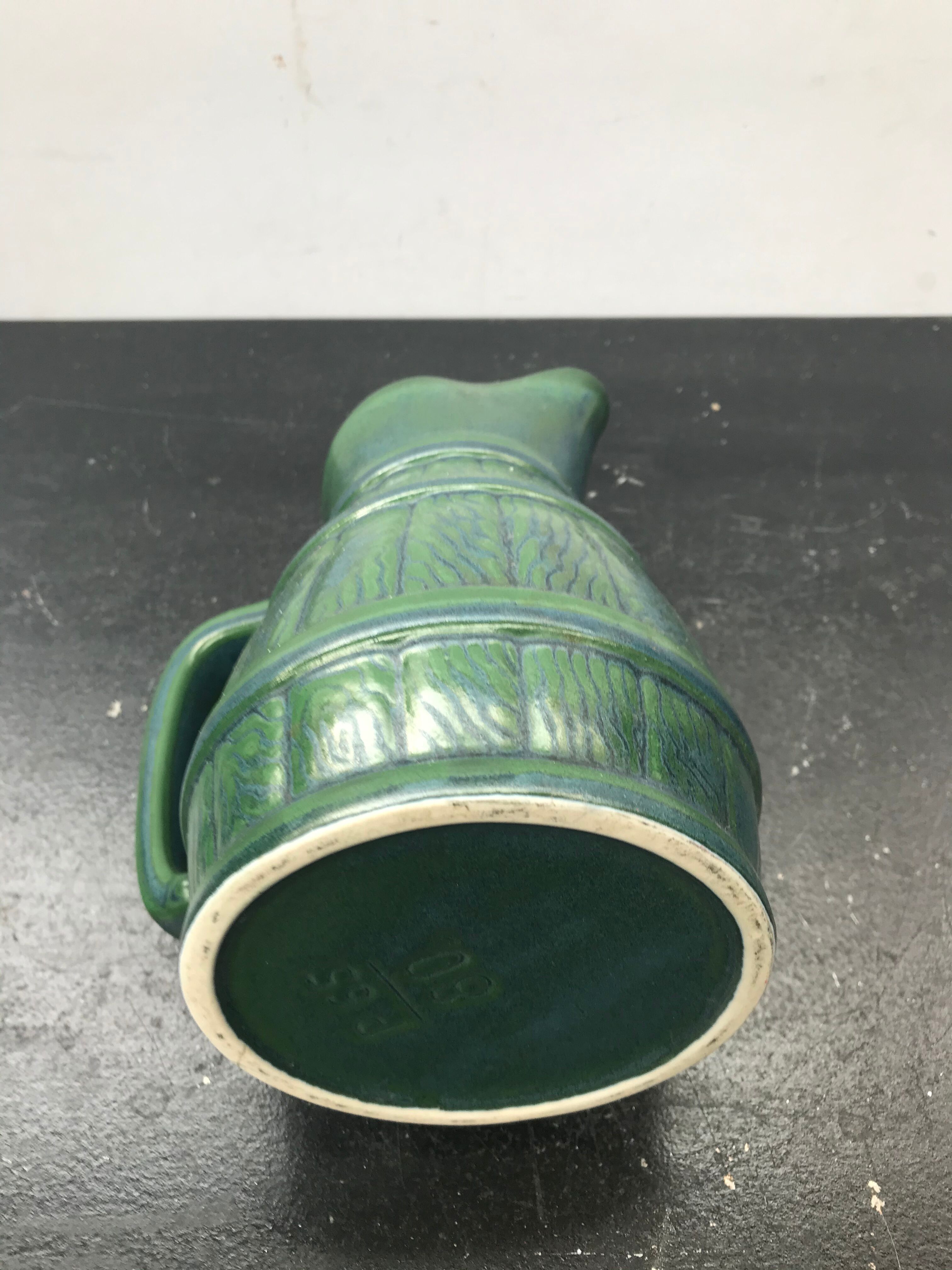 Former green ceramic pitcher shape tonneau