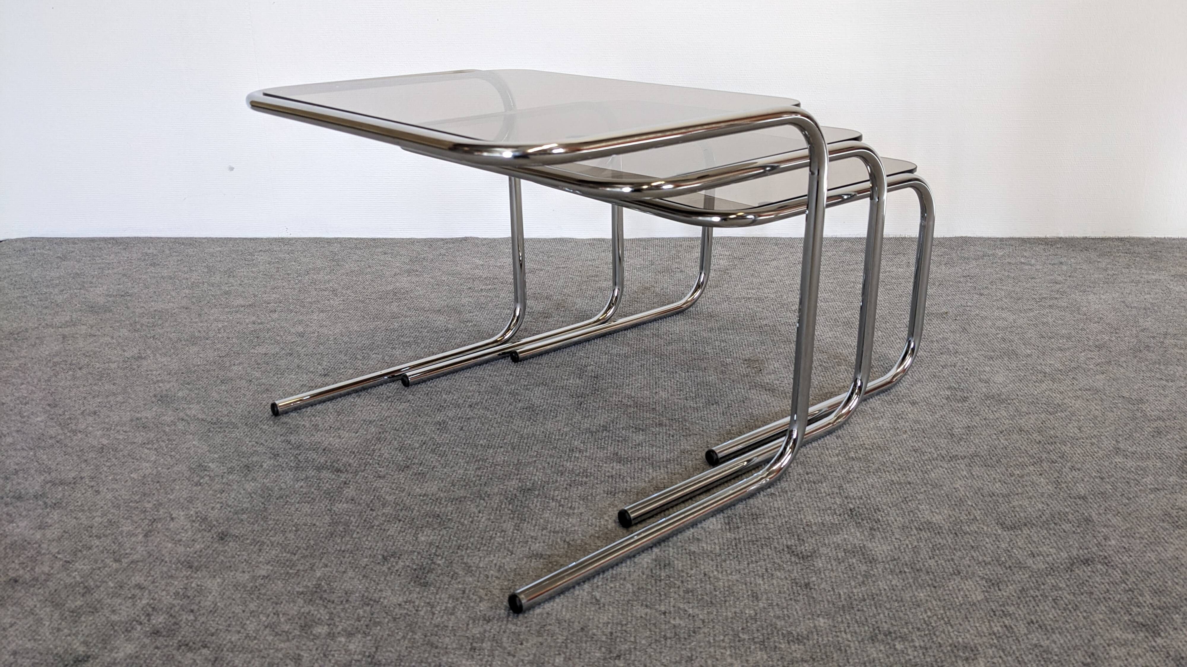 Nested tables with tubular chrome and smoked glass, France 1970.