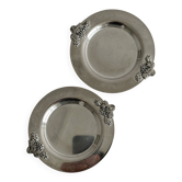 2 shiny metal bottle coasters