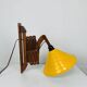 Scandinavian accordion wall light from the 60s, wood and yellow reflector