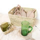Storage basket in braided palm leaves