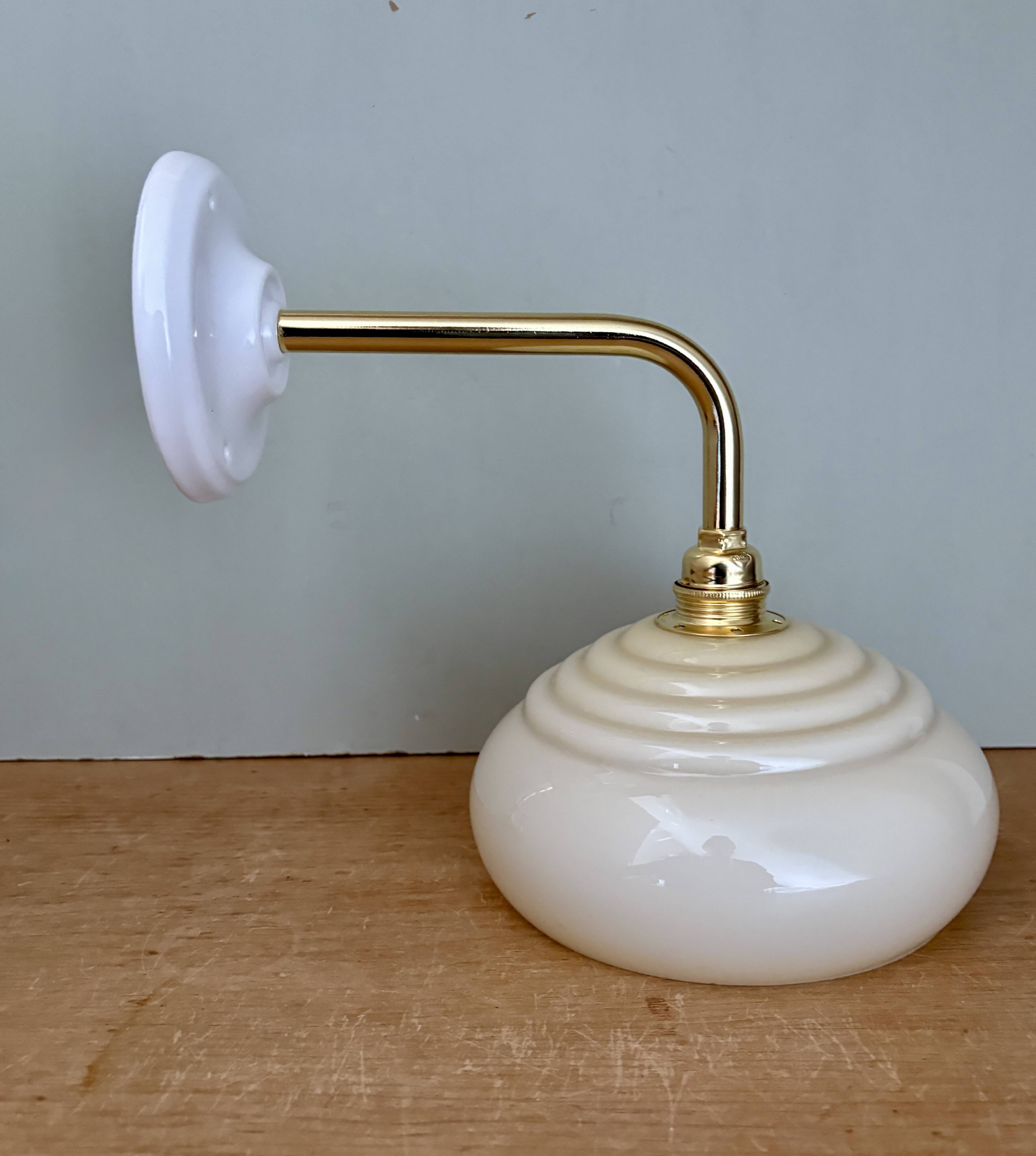 Vintage angled wall lamp with pale yellow opaline shade