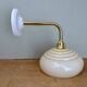 Vintage angled wall lamp with pale yellow opaline shade