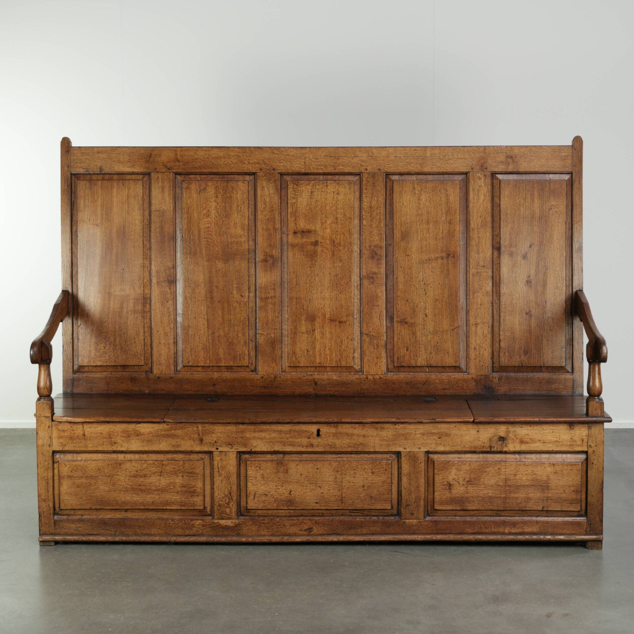 Antique English oak hall bench from the early 19th century with storage space