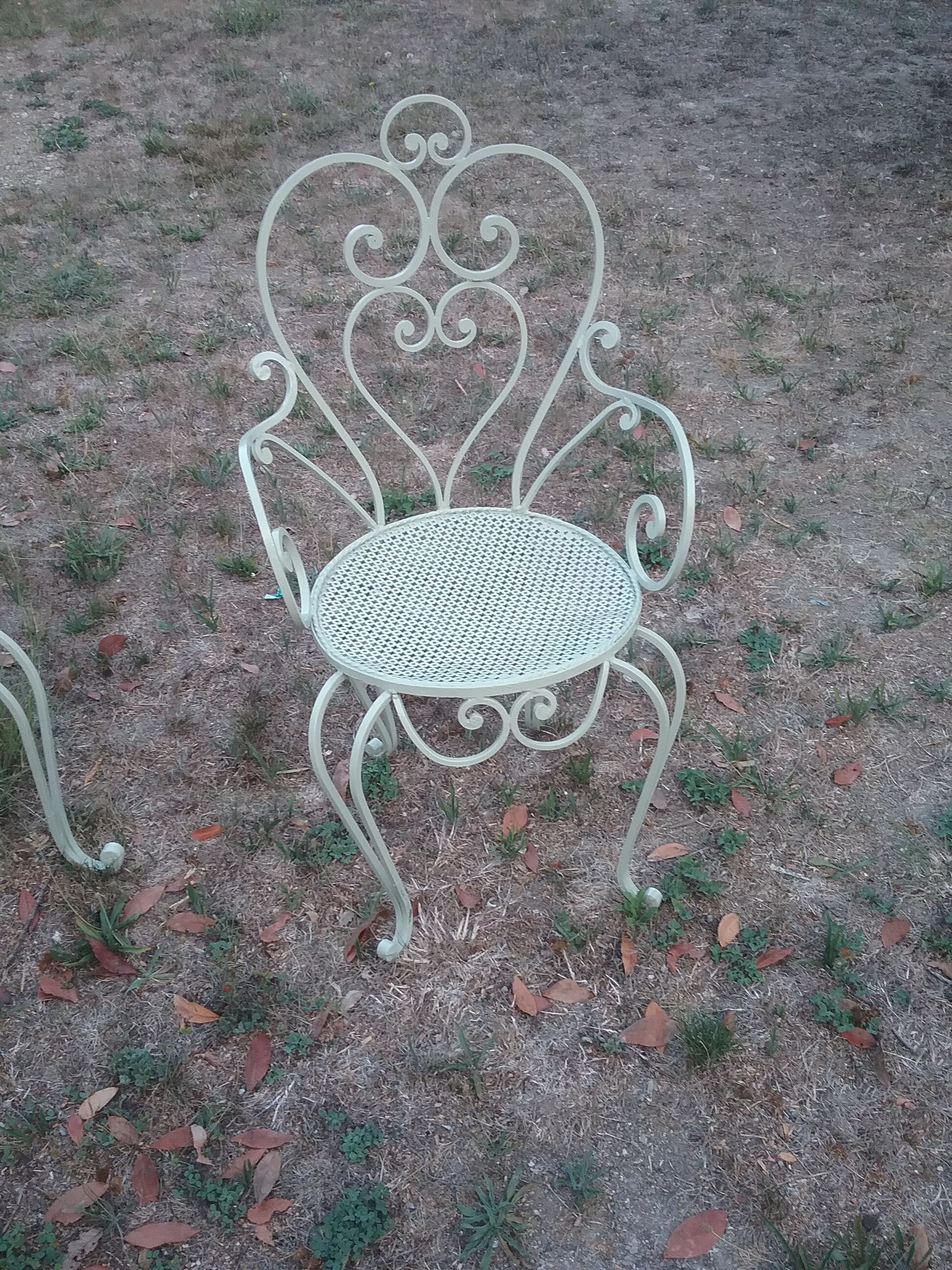 Garden furniture in green wrought iron