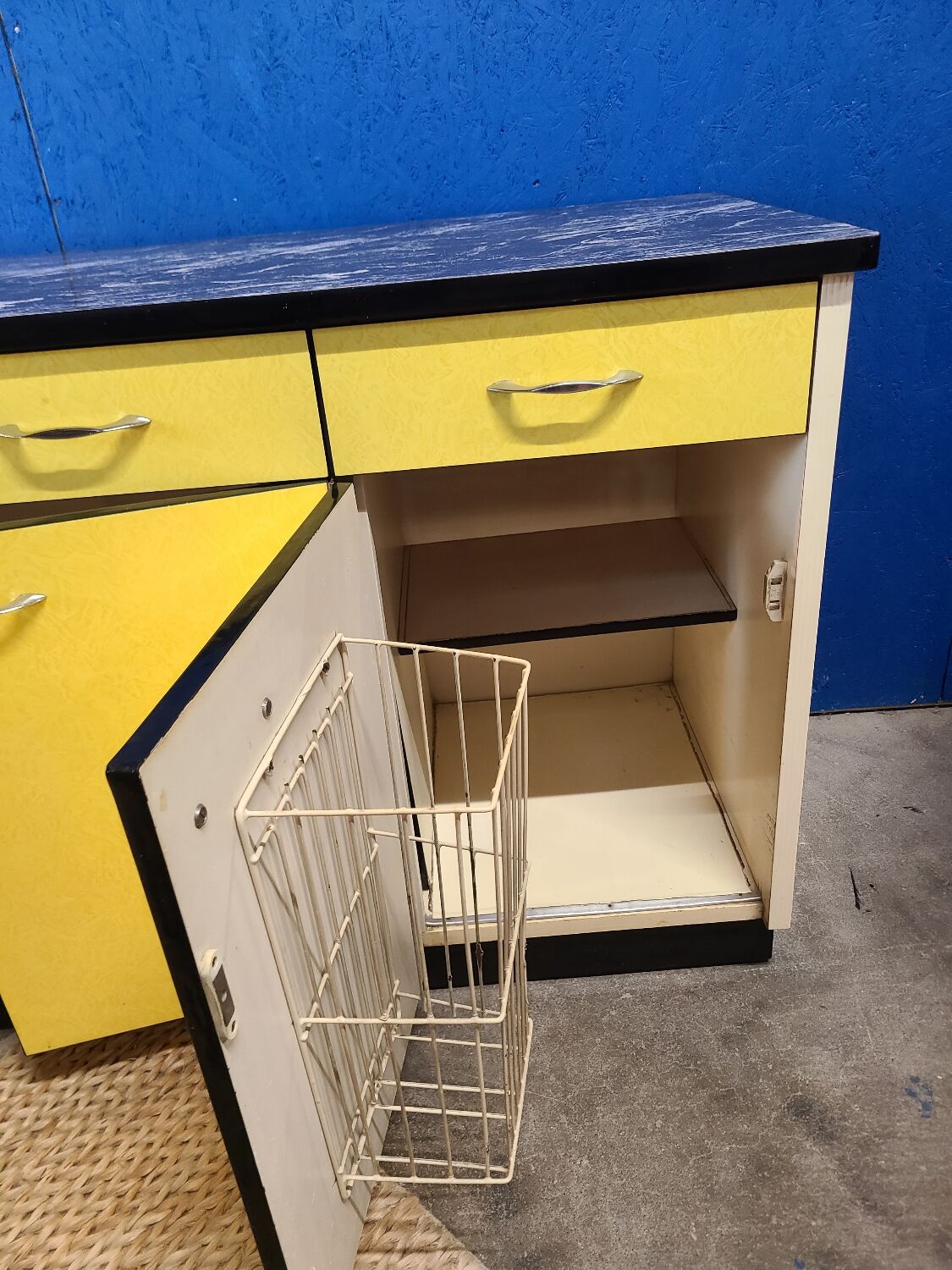 Vintage yellow sideboard, and black marble top.