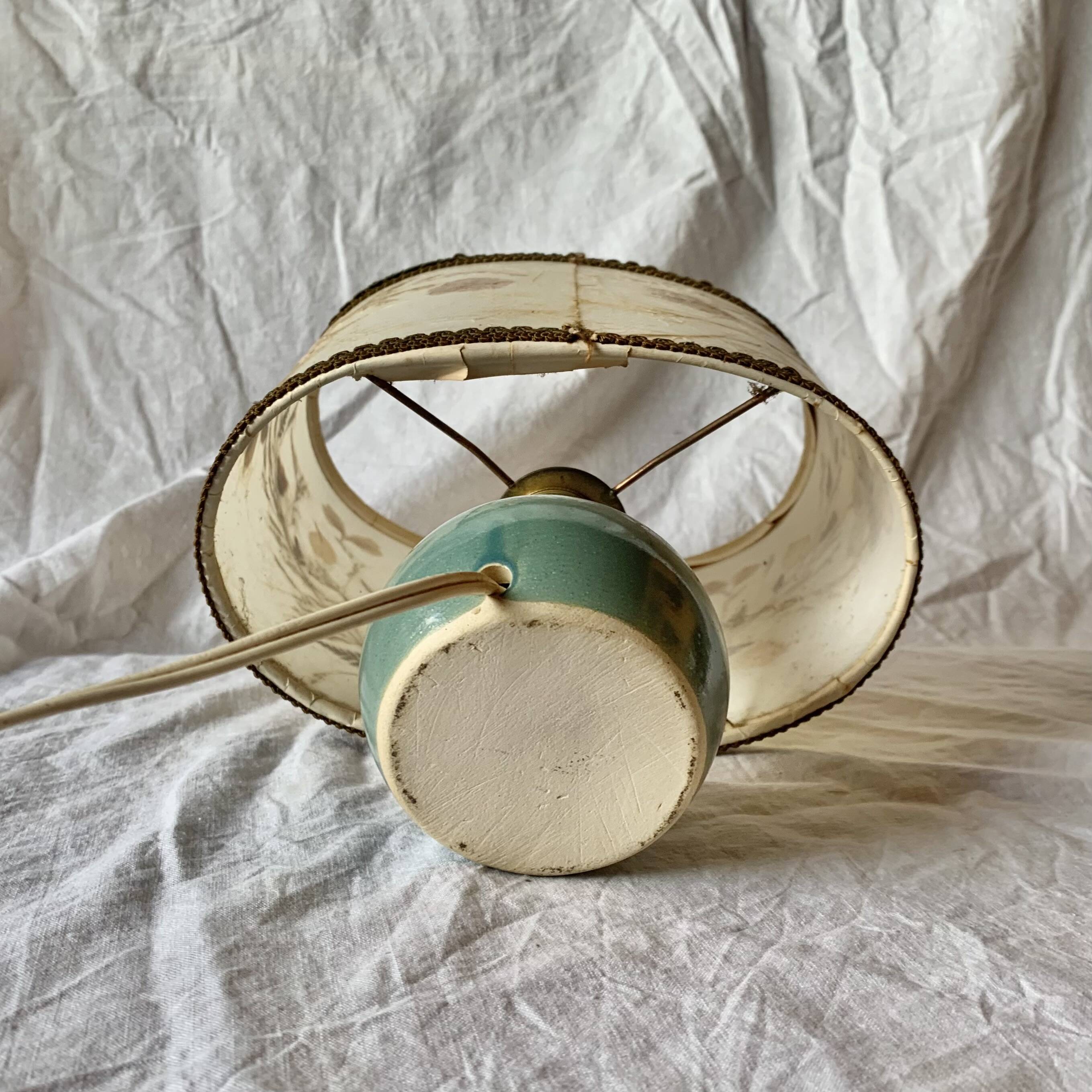 Old small green ceramic side lamp with dried flower lampshade