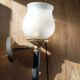 Frosted glass globe wall light with patinated gold metal base dp 1123204