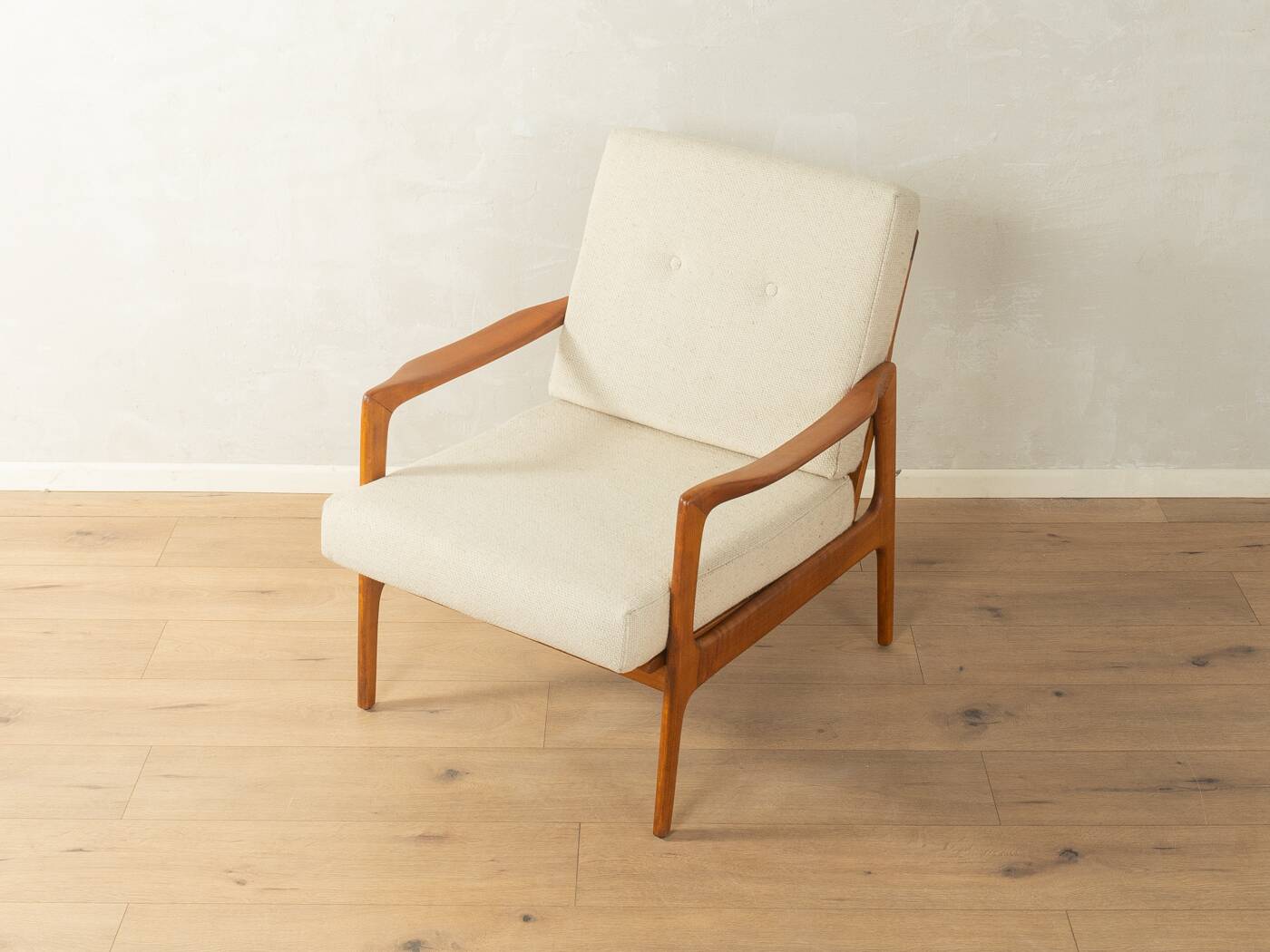 Elegant mid-century armchair from the 1960s with cream-white upholstery