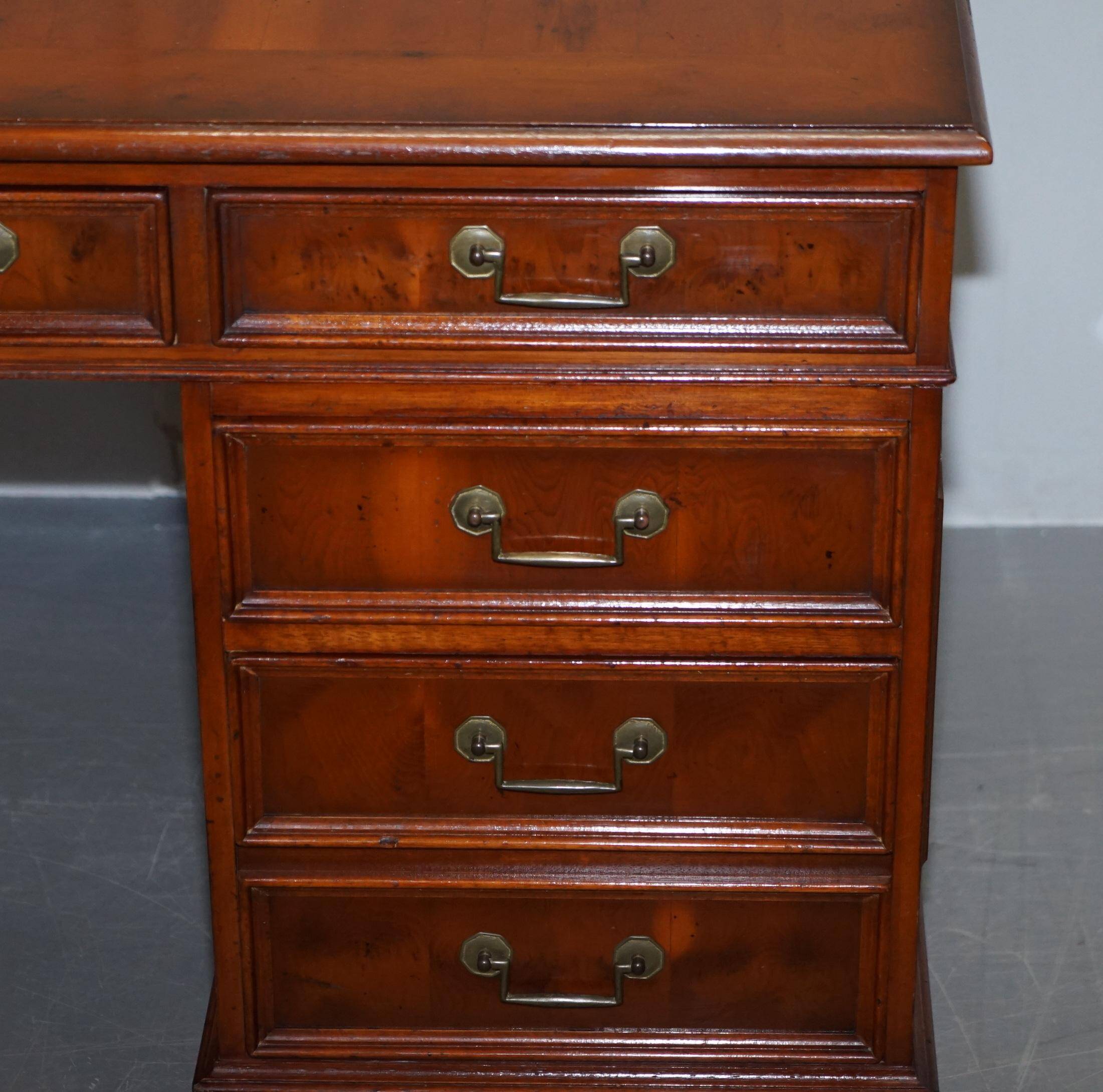Partner desk with double pedestal in burr yew wood with decorated top.