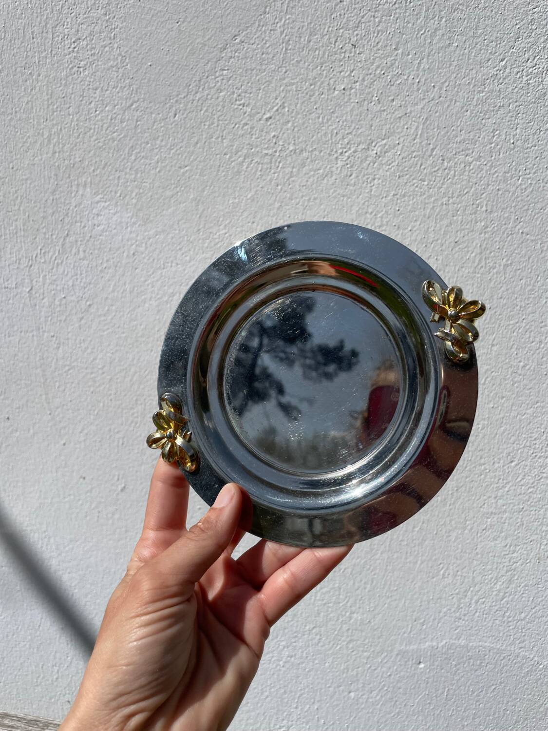 Silver-plated metal butter dish with knots