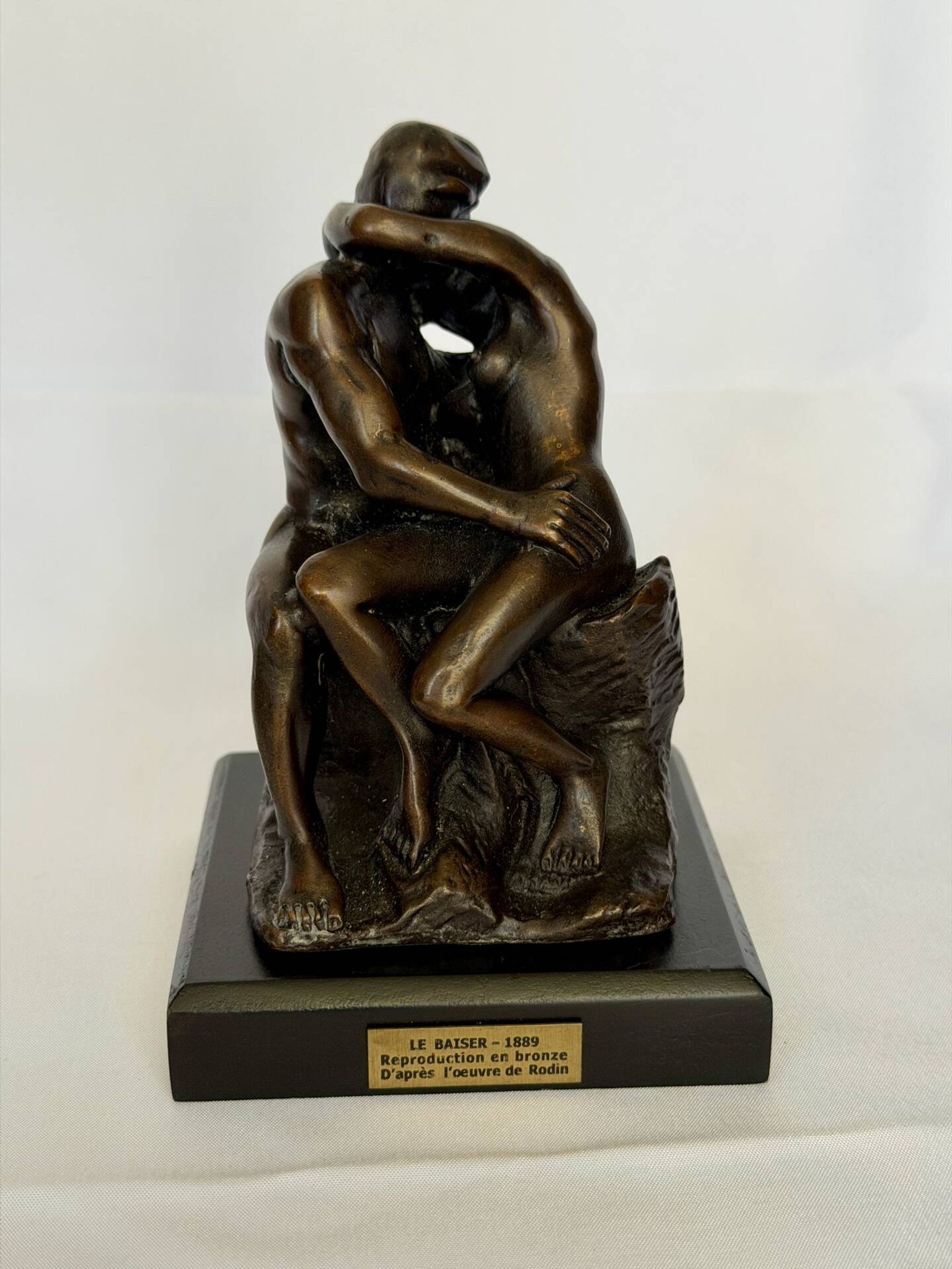 The bronze sculpture The Kiss, a reproduction of Rodin's statue, French sculpture.