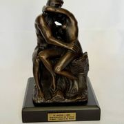The bronze sculpture The Kiss, a reproduction of Rodin's statue, French sculpture.
