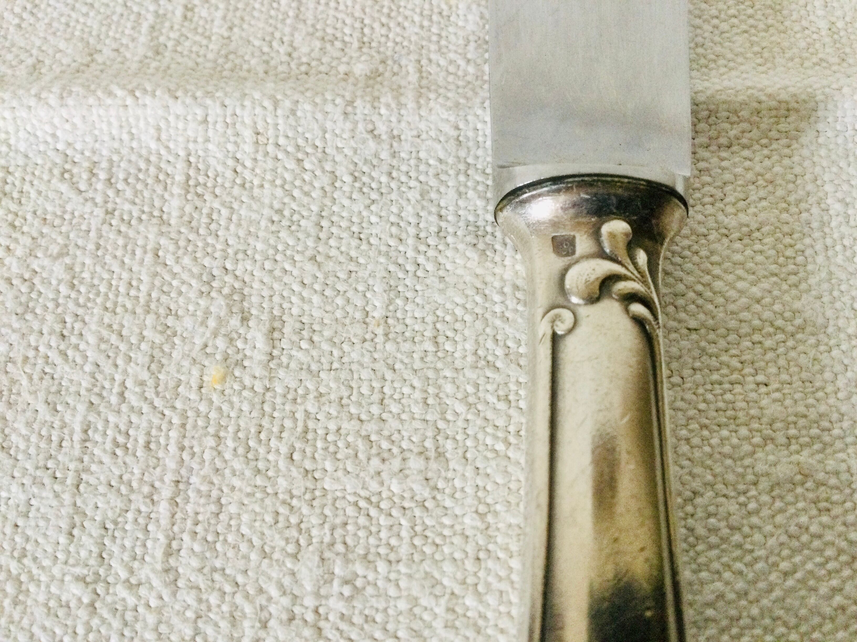 12 silver metal handle knives