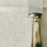 12 silver metal handle knives