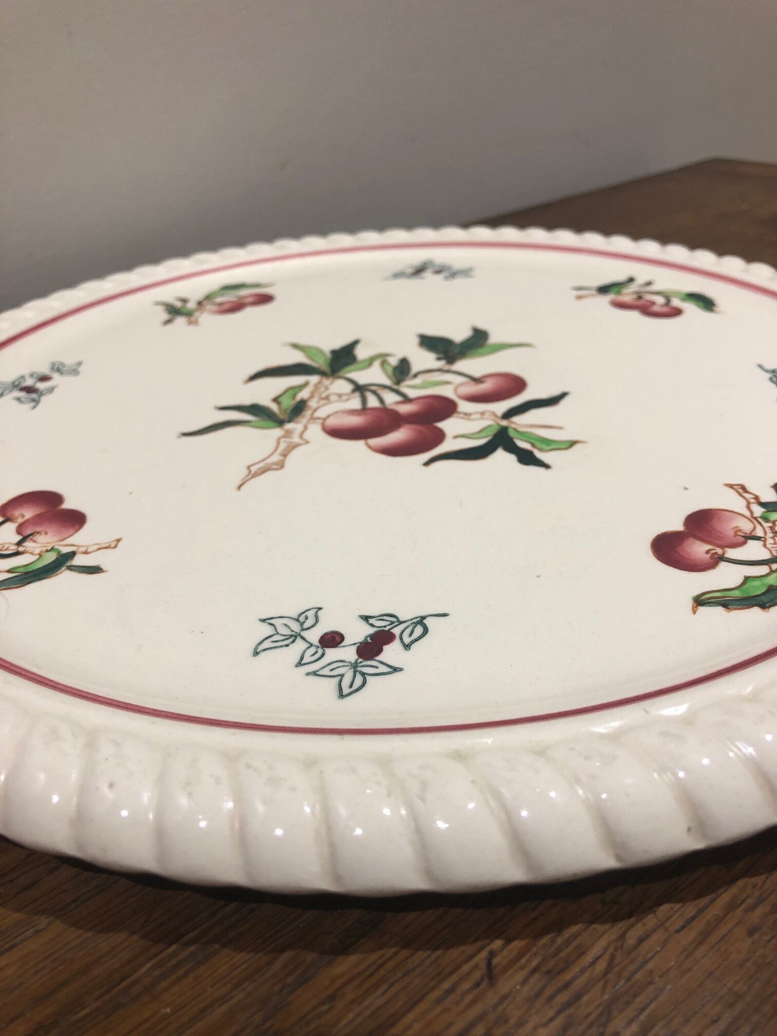 Longwy earthenware dish decorated with cherries