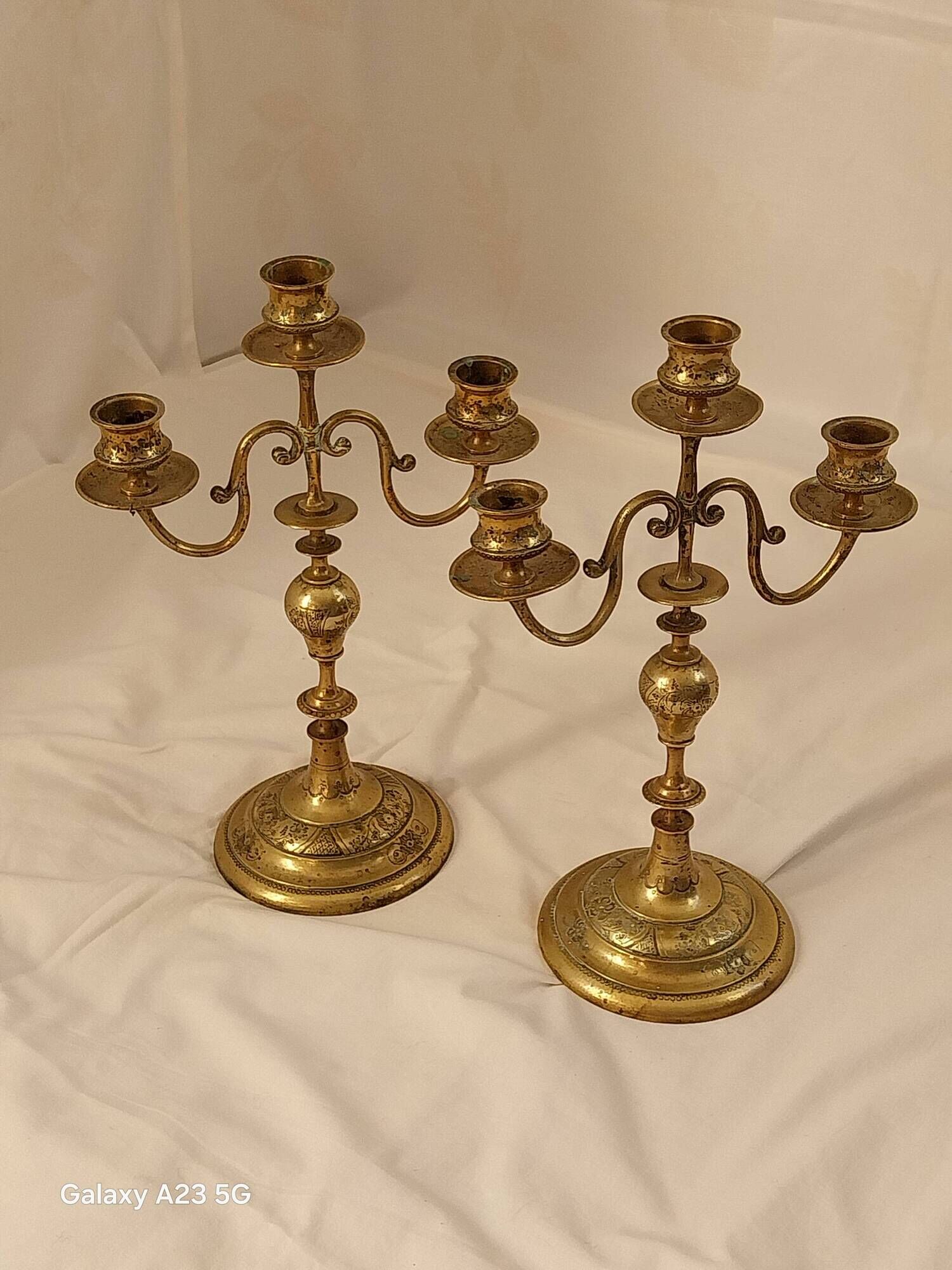 Pair of chiselled brass candelabra. Swedish craftsmanship, 20th century.