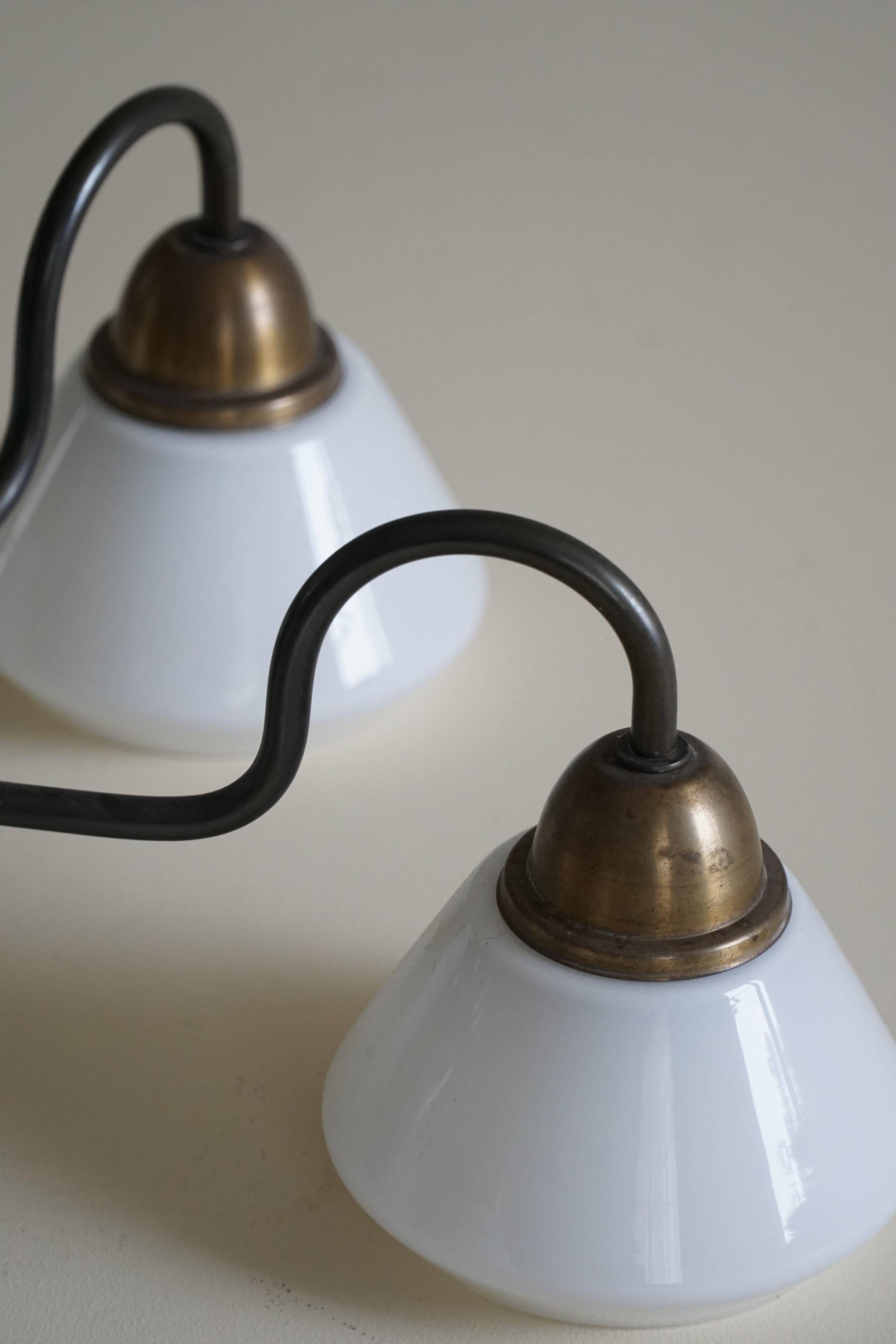 A modern Danish chandelier with 5 heads in opaline glass and brass, Art Deco, 1940s.