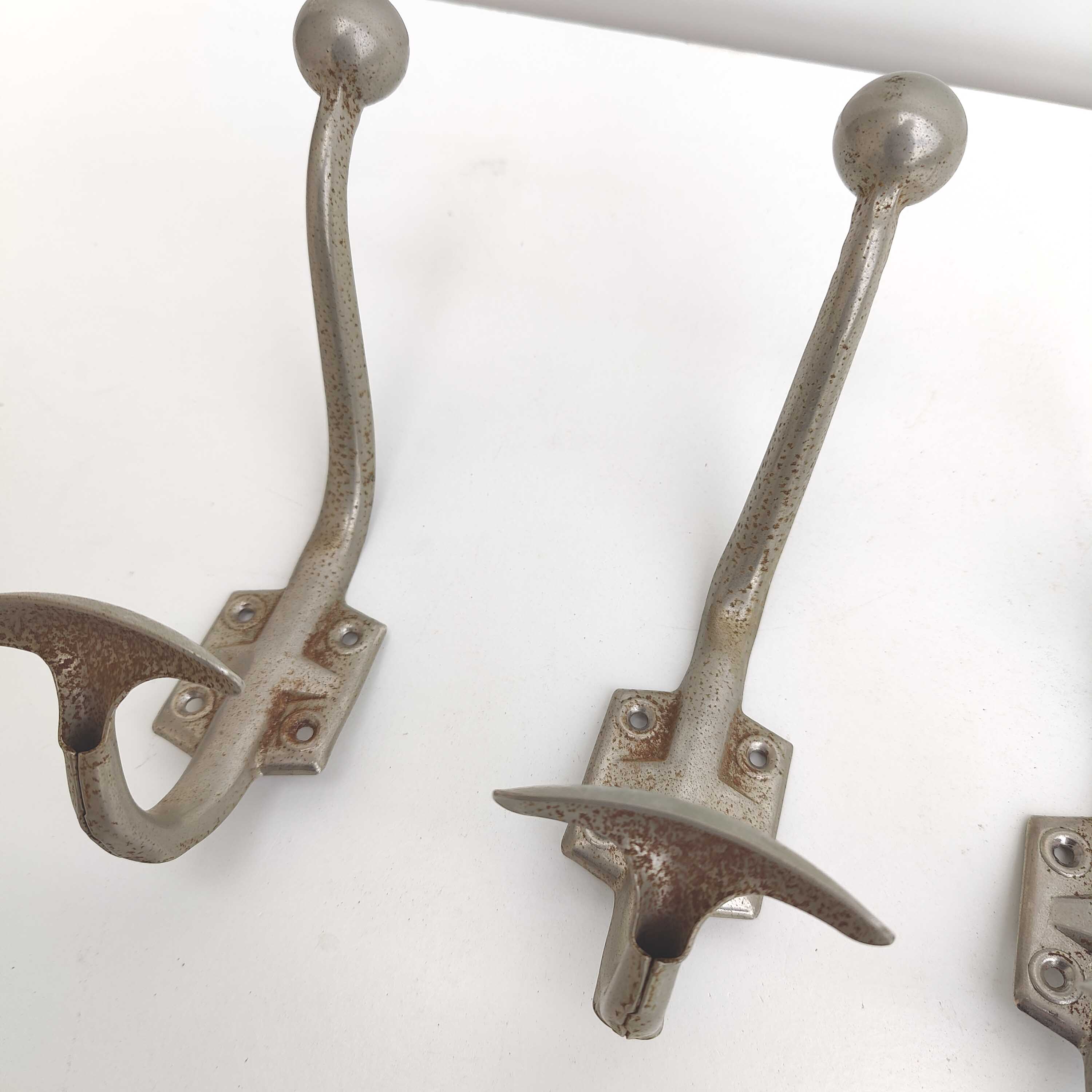 Three metal hooks