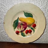 Faience plate in Longwy enamels signed Léa Valenti representing Fruits