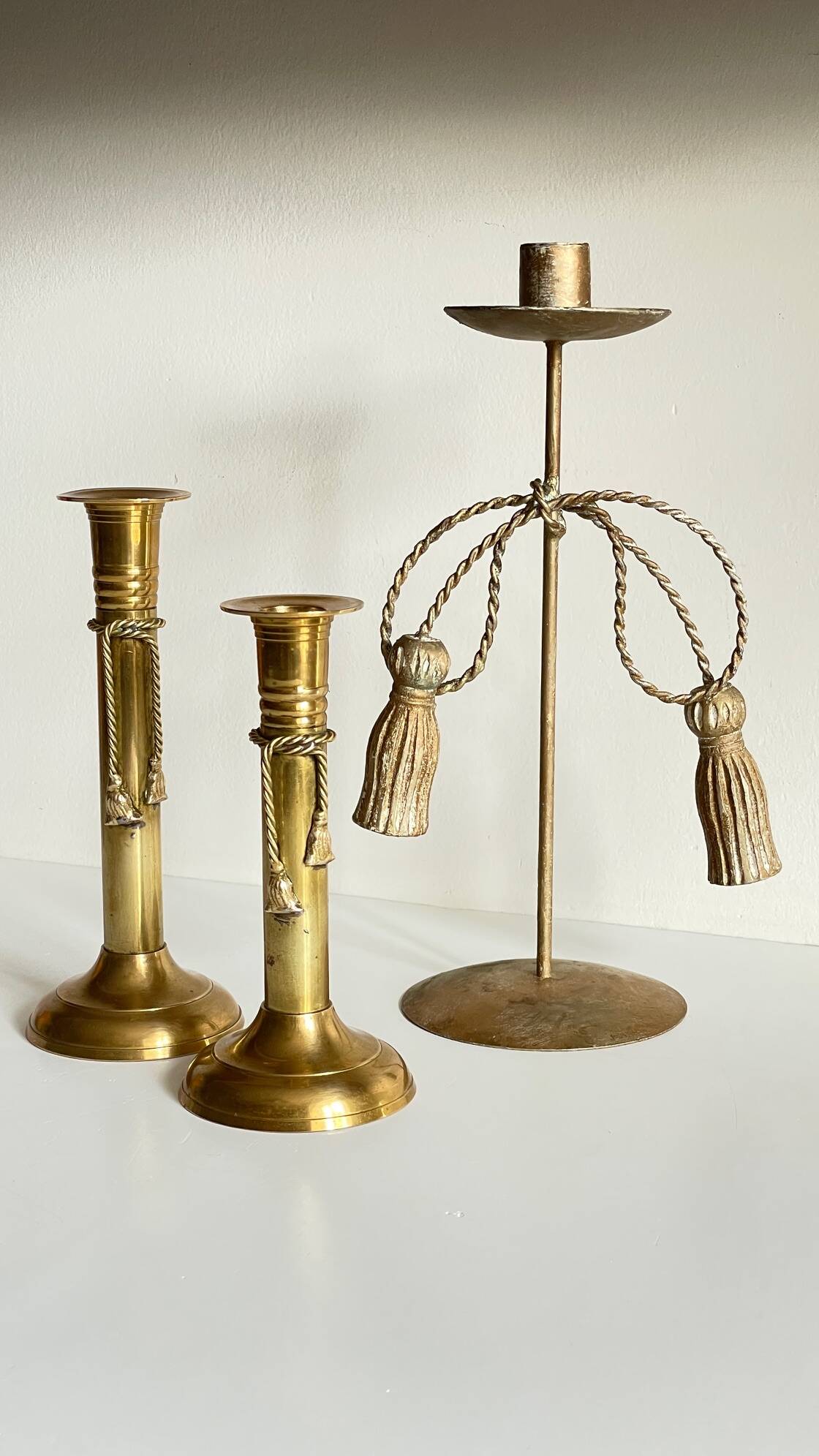 Trio of vintage knotted candlesticks brass