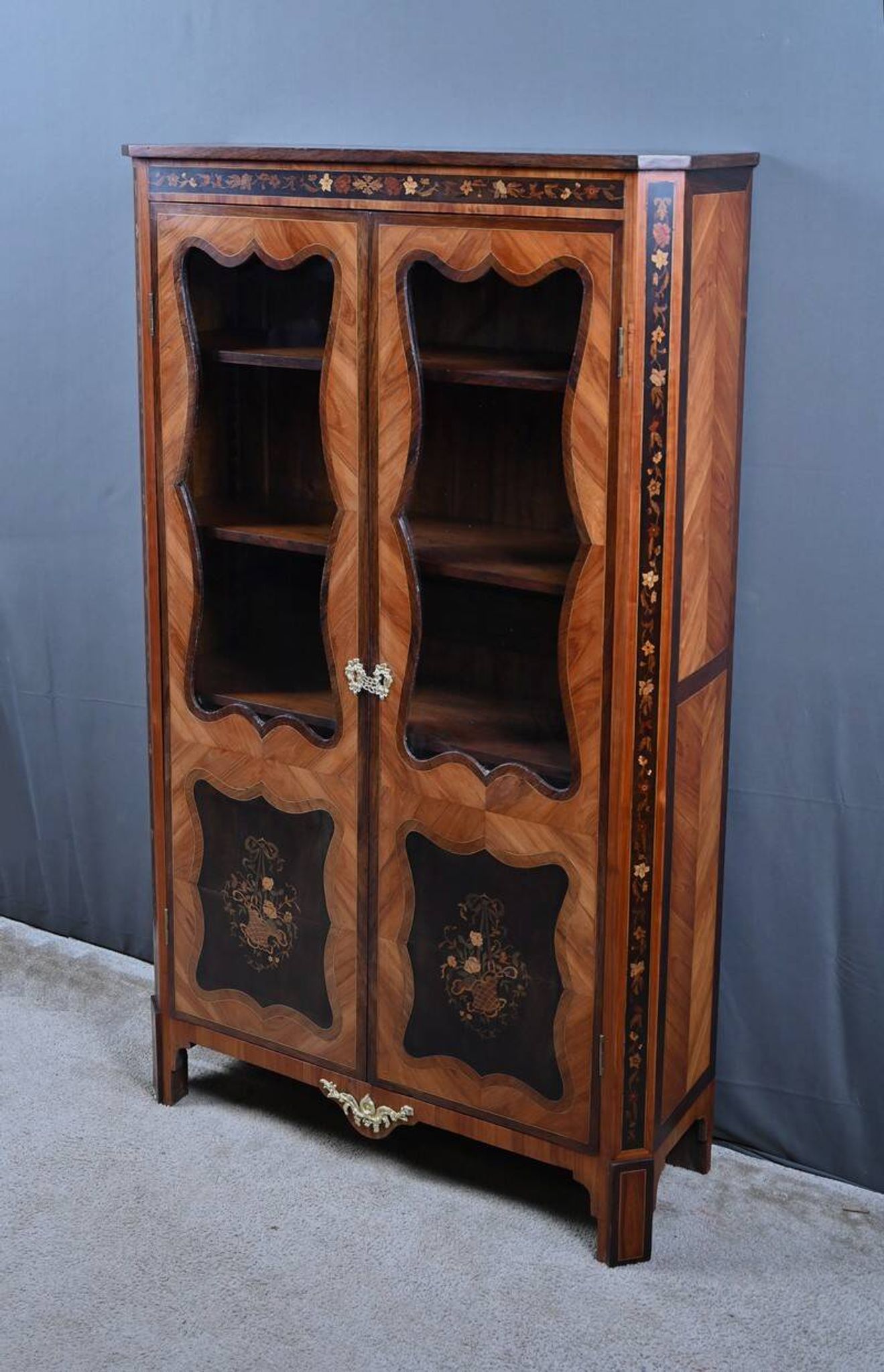 Showcase in precious wood marquetry, Louis XV Transition style.