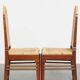Set of two Art Deco design dining chairs with a wooden frame