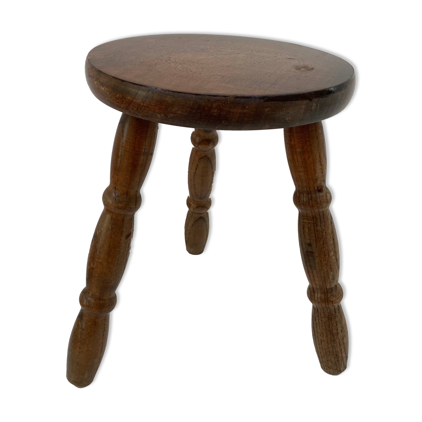 Old wooden tripod stool with ball feet
