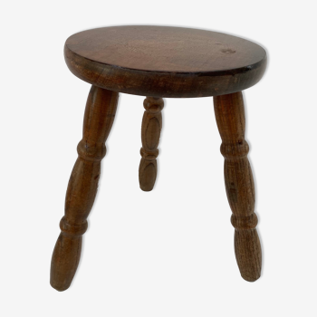 Old wooden tripod stool with ball feet