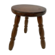 Old wooden tripod stool with ball feet