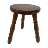 Old wooden tripod stool with ball feet