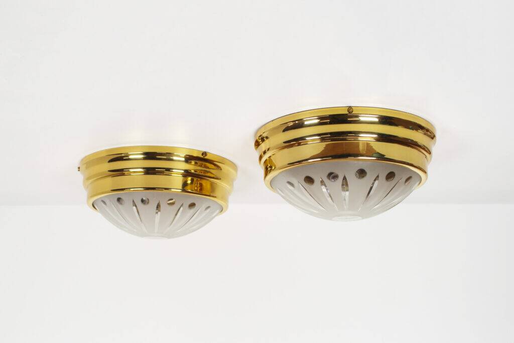Pair of vintage brass ceiling lights with glass globe